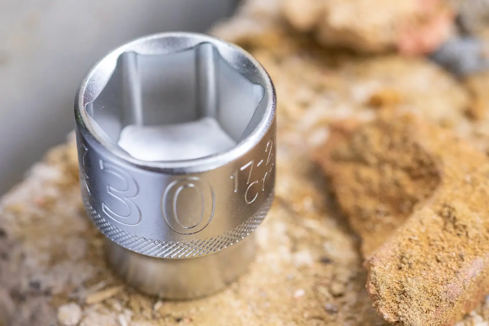 STANLEY FMMT17231-0 chrome socket tool close-up on rough stone surface.