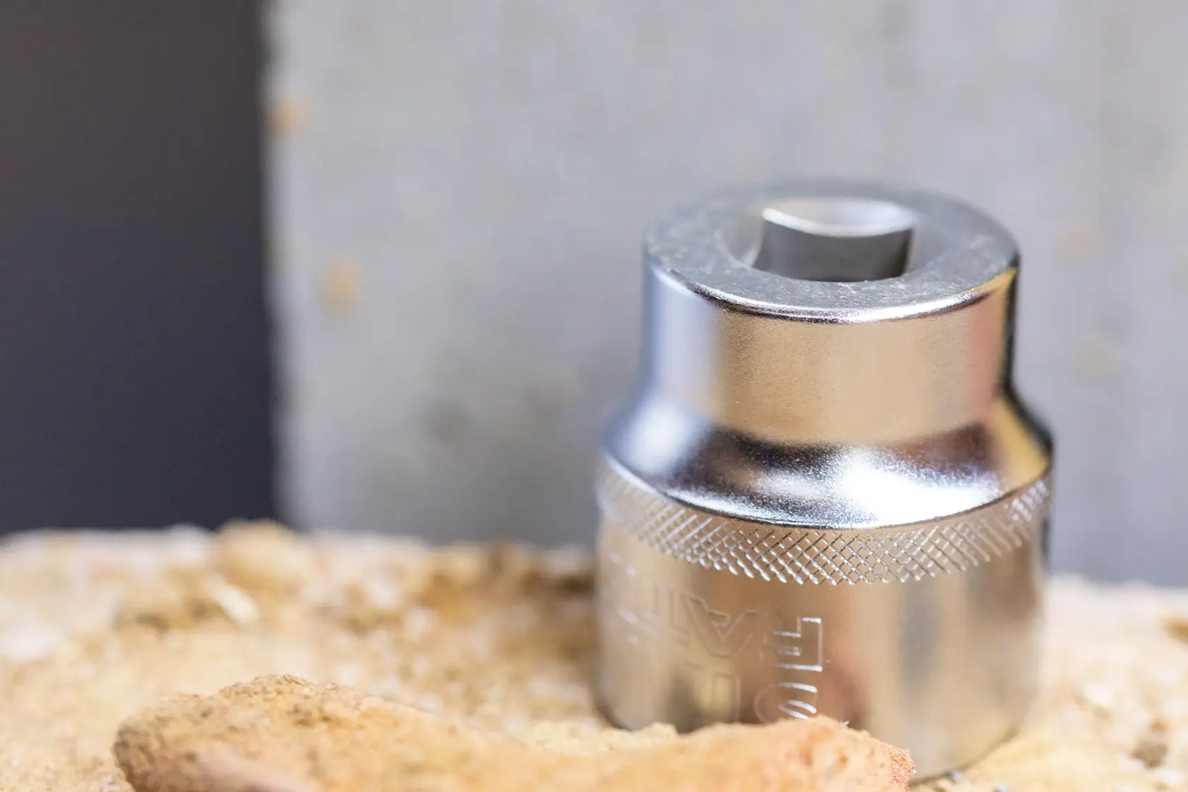 STANLEY FMMT17231-0 chrome socket tool on sandy surface, close-up photography.